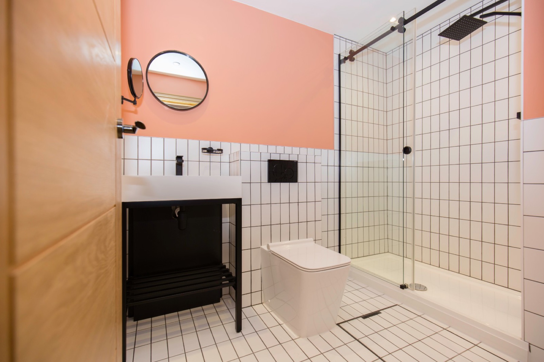 The finished bathroom with a coral feature wall